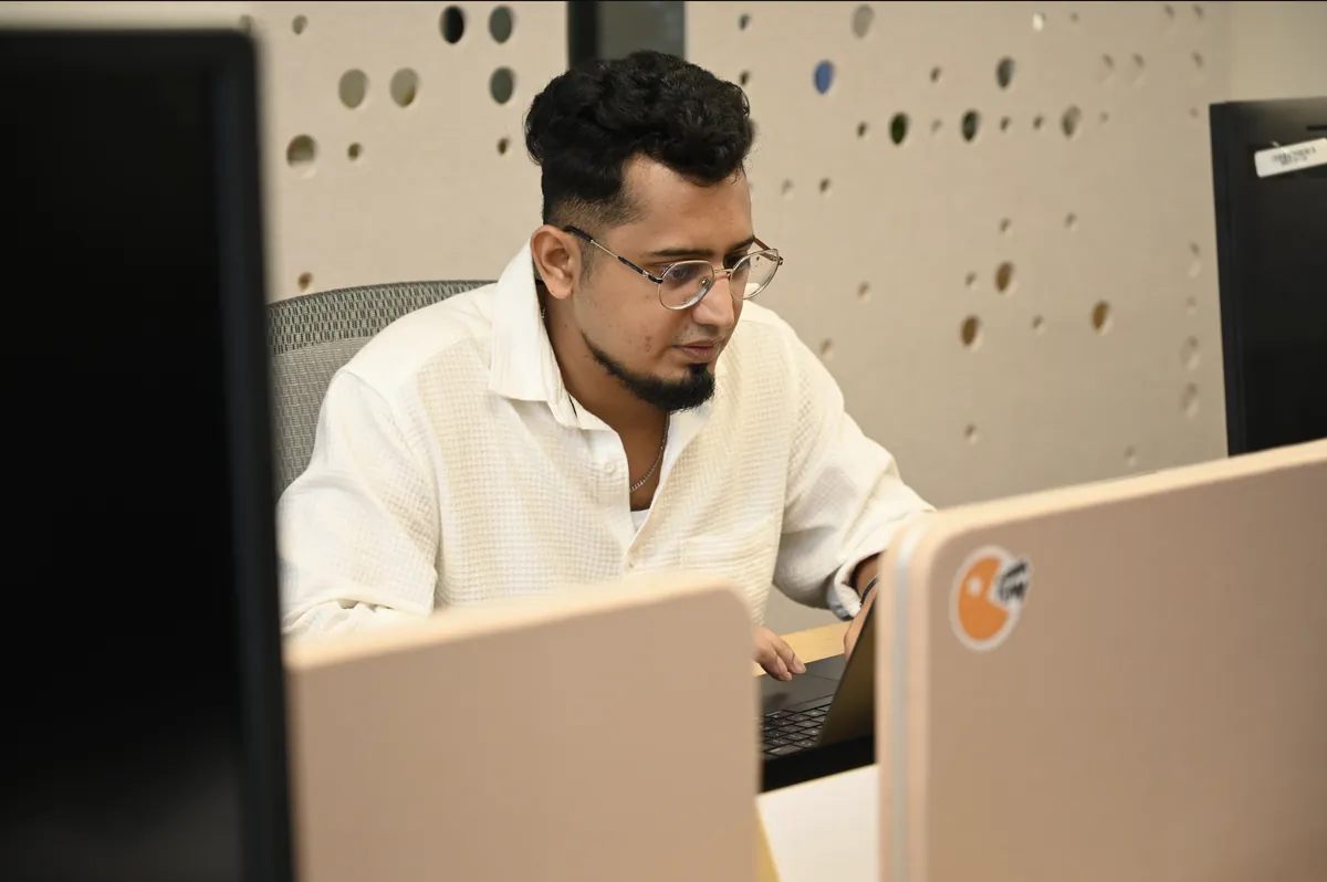 An engineer working at a desk